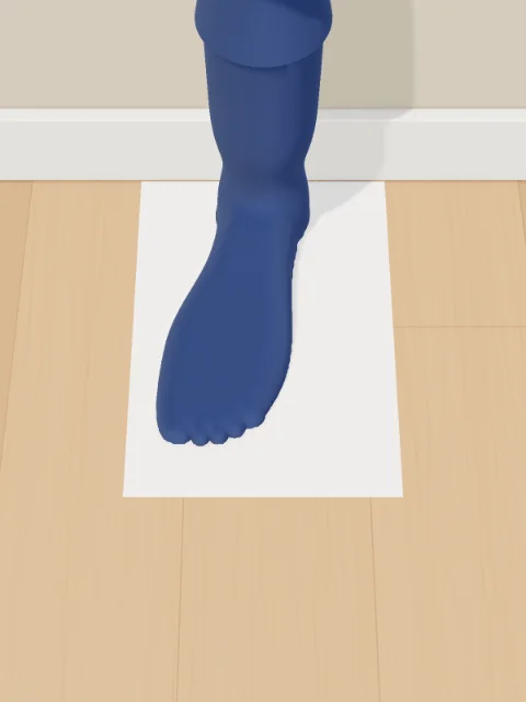 From above: the foot turned at an angle across the sheet.